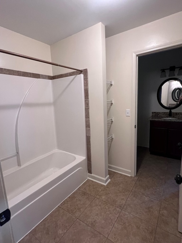 bathroom featuring tile patterned floors, vanity, and shower / bathtub combination