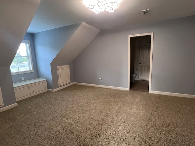 bonus room featuring carpet flooring and lofted ceiling