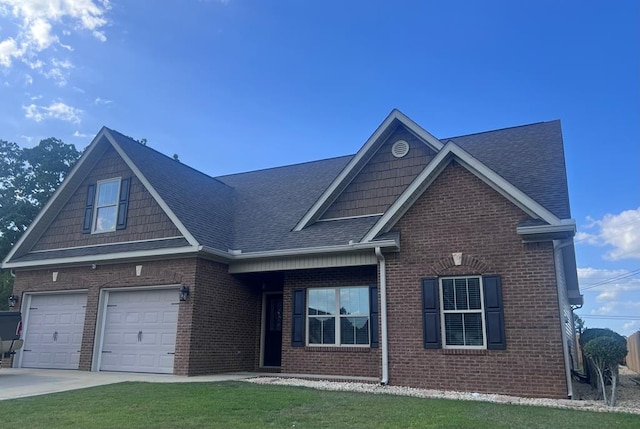 view of front of house featuring a front lawn and a garage