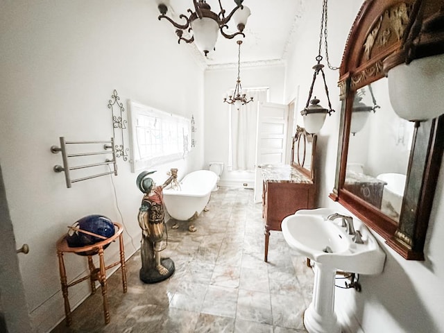 298 E Broad St, Ozark, AL 36360 - full bath with a chandelier, a freestanding tub, baseboards, and ornamental molding