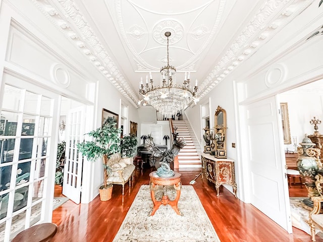 298 E Broad St, Ozark, AL 36360 - living area with a chandelier, wood finished floors, stairway, a high ceiling, and french doors