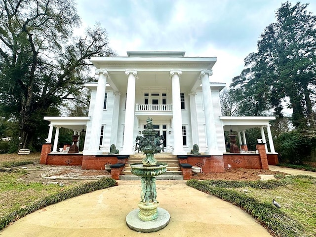 298 E Broad St, Ozark, AL 36360 - view of front facade with covered porch and a balcony