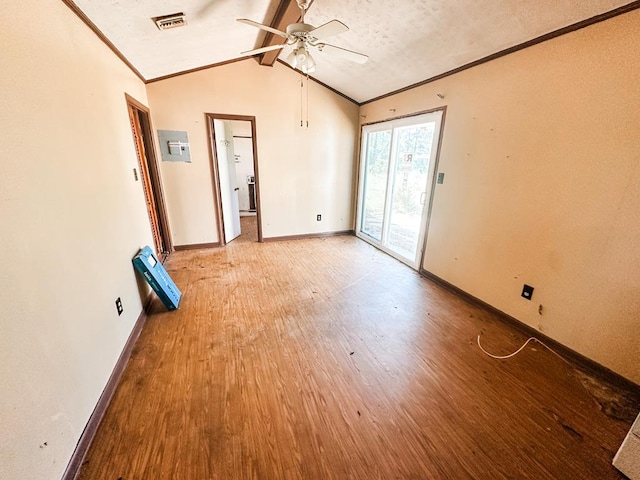 unfurnished room with light wood-style flooring, a ceiling fan, visible vents, vaulted ceiling with beams, and baseboards