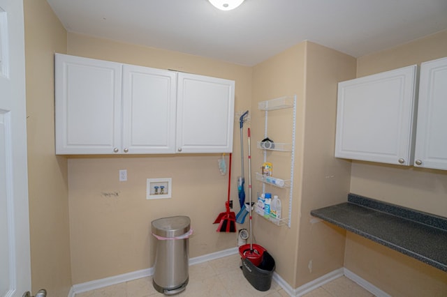 laundry area with washer hookup and cabinets