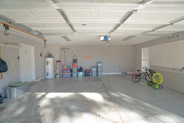 garage featuring electric water heater and a garage door opener