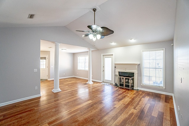 unfurnished living room featuring vaulted ceiling, a premium fireplace, hardwood / wood-style flooring, and ceiling fan