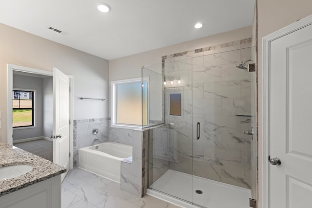 bathroom with vanity and plus walk in shower