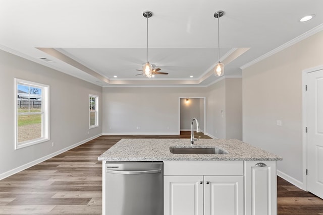 kitchen featuring a raised ceiling, ceiling fan, sink, dishwasher, and white cabinetry