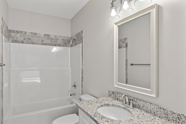 full bathroom with shower / tub combination, vanity, and toilet