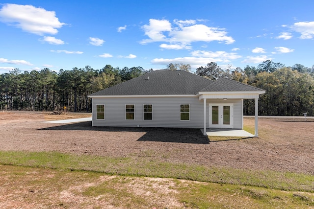 rear view of property featuring french doors