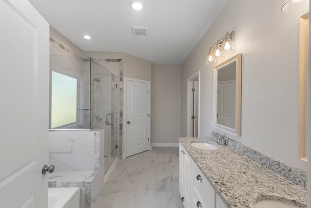 bathroom with vanity and independent shower and bath