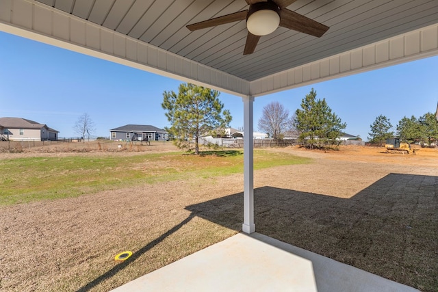 view of yard featuring ceiling fan and a patio area