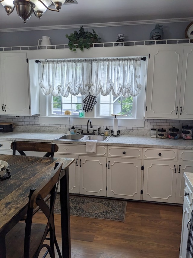 kitchen featuring sink, white cabinets, and a healthy amount of sunlight