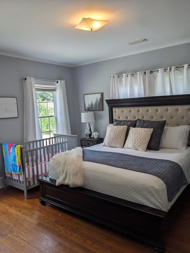 bedroom featuring hardwood / wood-style floors