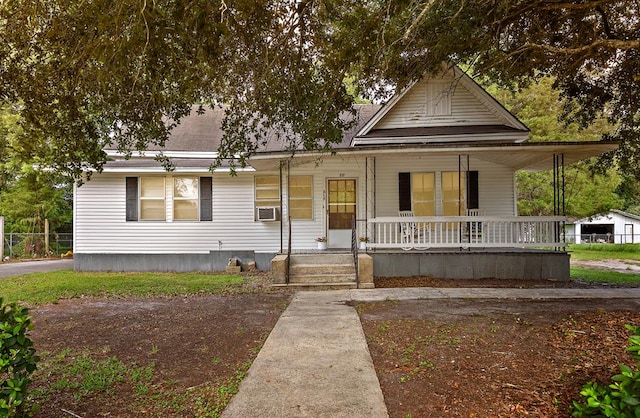 217 S S Greenwood St, Geneva, AL 36340 - view of front of house featuring covered porch