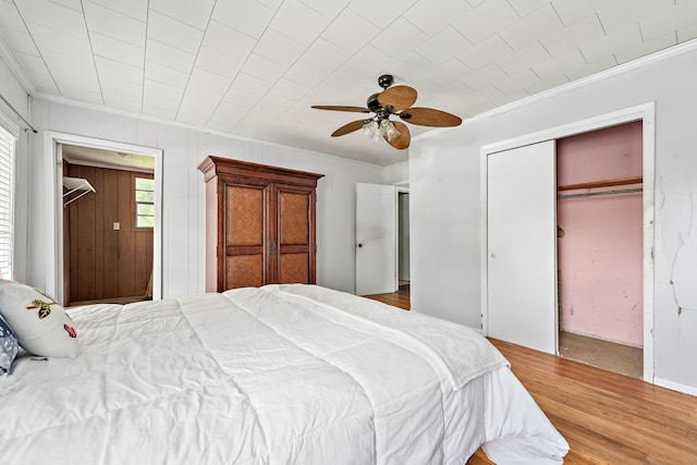 217 S S Greenwood St, Geneva, AL 36340 - bedroom featuring ornamental molding, wood finished floors, ceiling fan, and a closet