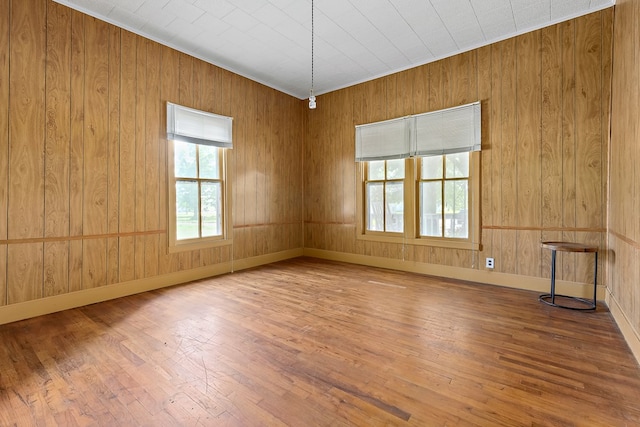 217 S S Greenwood St, Geneva, AL 36340 - unfurnished room featuring wood finished floors and wood walls