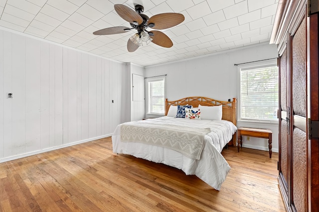 217 S S Greenwood St, Geneva, AL 36340 - bedroom with multiple windows, light wood-style floors, and baseboards