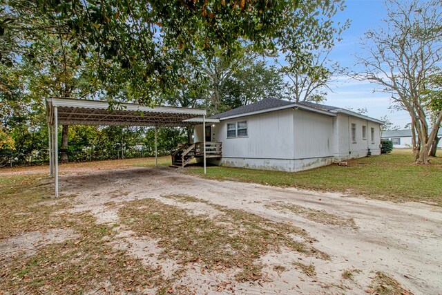 view of property exterior with a carport