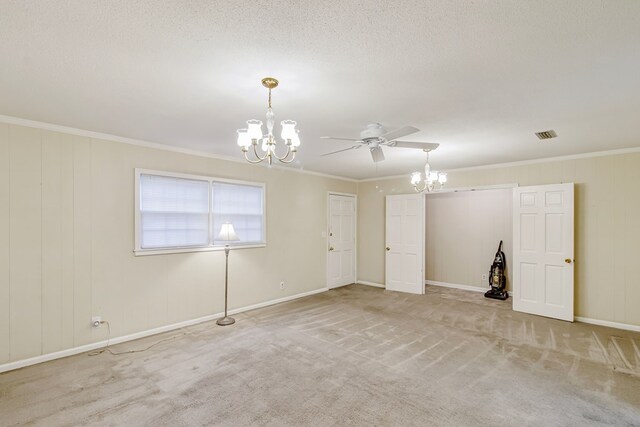 unfurnished room with a textured ceiling, ceiling fan with notable chandelier, crown molding, and light carpet