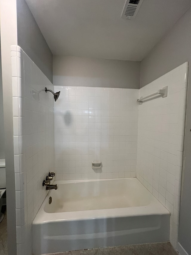 bathroom featuring tiled shower / bath combo