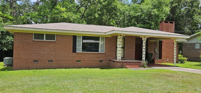 1109 Sumter St, Dothan, AL 36301 - view of front of house featuring crawl space, driveway, a front lawn, brick siding, and a chimney