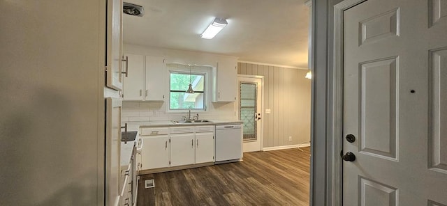 1109 Sumter St, Dothan, AL 36301 - kitchen featuring white dishwasher, light countertops, white cabinets, dark wood-style floors, and crown molding