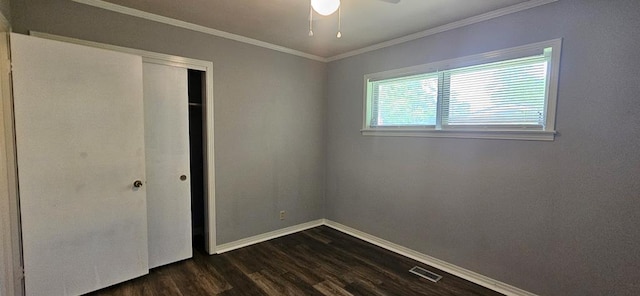 1109 Sumter St, Dothan, AL 36301 - unfurnished bedroom with dark wood-type flooring, crown molding, a closet, and ceiling fan