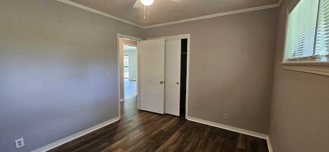 1109 Sumter St, Dothan, AL 36301 - unfurnished bedroom with dark wood-type flooring, multiple windows, a closet, ornamental molding, and a ceiling fan