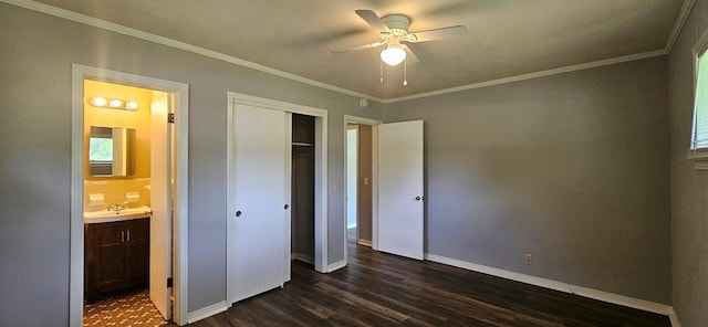 1109 Sumter St, Dothan, AL 36301 - unfurnished bedroom featuring dark wood-style flooring, ornamental molding, a closet, connected bathroom, and a ceiling fan