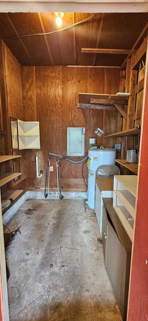 1109 Sumter St, Dothan, AL 36301 - miscellaneous room featuring electric panel, unfinished concrete flooring, wooden walls, and water heater