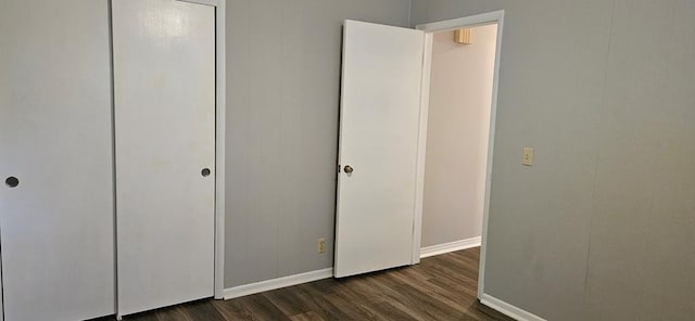 1109 Sumter St, Dothan, AL 36301 - unfurnished bedroom featuring dark wood-type flooring and baseboards