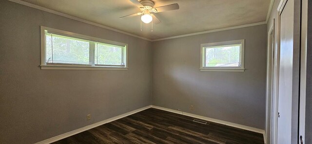 1109 Sumter St, Dothan, AL 36301 - unfurnished room with plenty of natural light, dark wood finished floors, ceiling fan, and ornamental molding