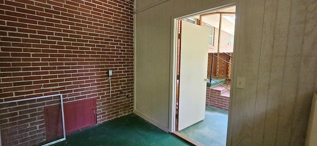 1109 Sumter St, Dothan, AL 36301 - hall with brick wall and dark colored carpet