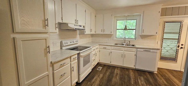 1109 Sumter St, Dothan, AL 36301 - kitchen featuring white appliances, under cabinet range hood, decorative backsplash, and dark wood-type flooring