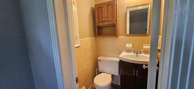 1109 Sumter St, Dothan, AL 36301 - half bath with tile walls, vanity, and a wainscoted wall