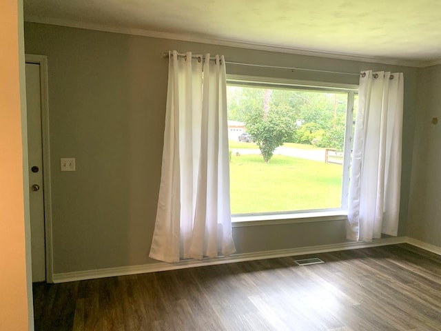 1109 Sumter St, Dothan, AL 36301 - unfurnished room with dark wood-style flooring and ornamental molding