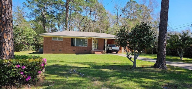 1109 Sumter St, Dothan, AL 36301 - view of front of house featuring crawl space, concrete driveway, a front yard, and brick siding