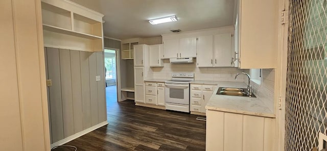 1109 Sumter St, Dothan, AL 36301 - kitchen featuring white electric range oven, tasteful backsplash, dark wood-style flooring, open shelves, and white cabinets