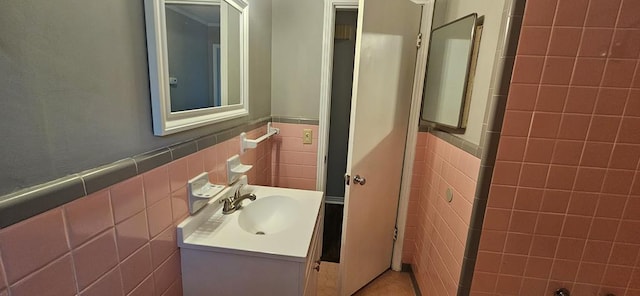 1109 Sumter St, Dothan, AL 36301 - bathroom with tile walls, vanity, wainscoting, and tile patterned floors