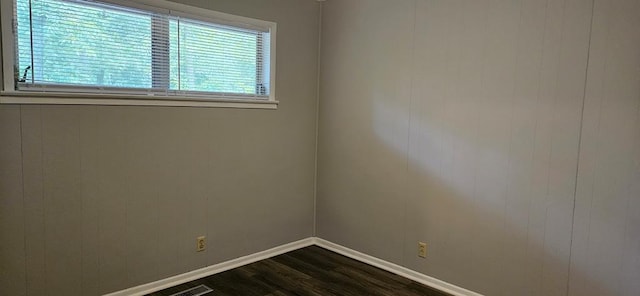 1109 Sumter St, Dothan, AL 36301 - empty room featuring dark wood finished floors and baseboards