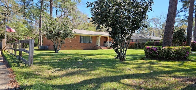 1109 Sumter St, Dothan, AL 36301 - view of front facade featuring crawl space, a front yard, and brick siding