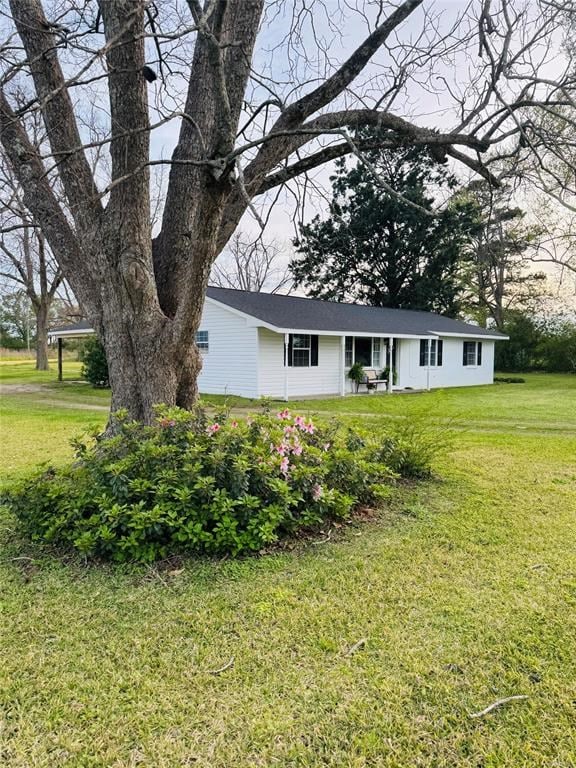 view of front of home with a front yard