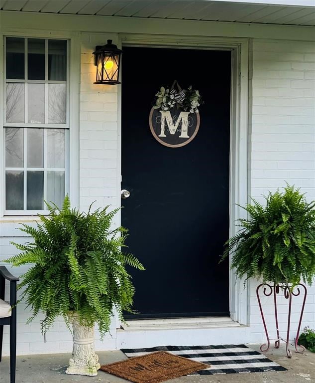 property entrance with concrete block siding
