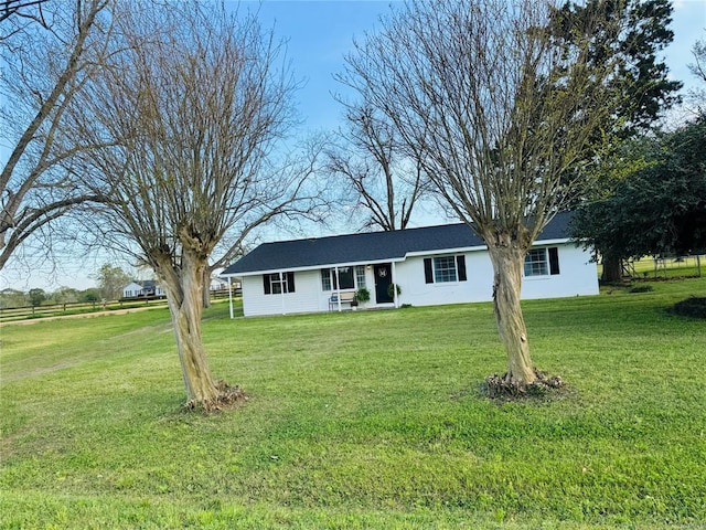 single story home with a front lawn