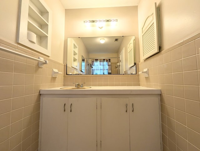 602 Cobb Rd, Dothan, AL 36301 - full bathroom featuring tile walls, vanity, a shower, and wainscoting