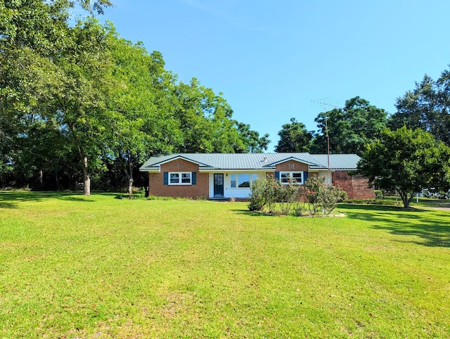602 Cobb Rd, Dothan, AL 36301 - ranch-style home with a front yard and a metal roof