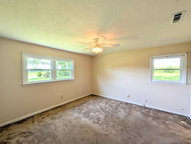 602 Cobb Rd, Dothan, AL 36301 - spare room featuring plenty of natural light, ceiling fan, carpet floors, and a textured ceiling