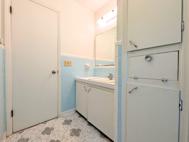 602 Cobb Rd, Dothan, AL 36301 - bathroom with vanity, tile walls, tile patterned floors, and wainscoting