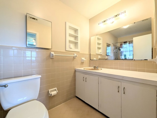 602 Cobb Rd, Dothan, AL 36301 - bathroom with tile walls, vanity, curtained shower, tile patterned flooring, and wainscoting
